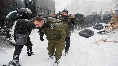 Ukraine: police raid protester camp