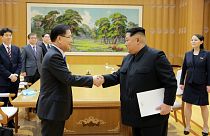 Kim Jong Un greets Chung Eui-yong, head of the National Security sud