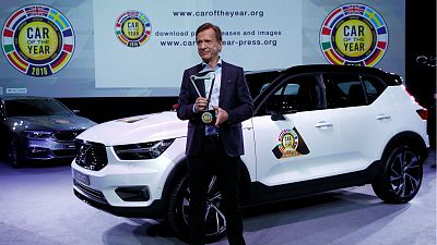 Volvo Car Group CEO Hakan Samuelsson poses next to the Volvo XC40