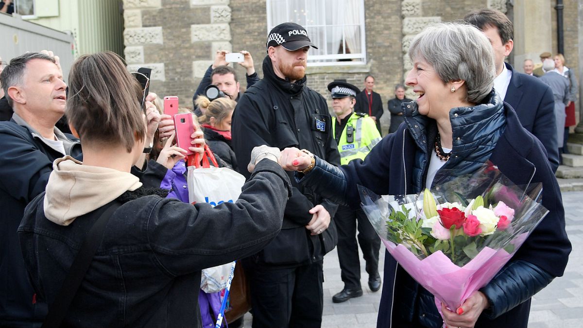 May fist bumps and poses for selfies during Salisbury visit
