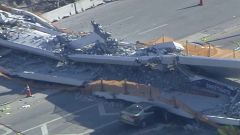 Several vehicles with bodies inside are still trapped under the rubble