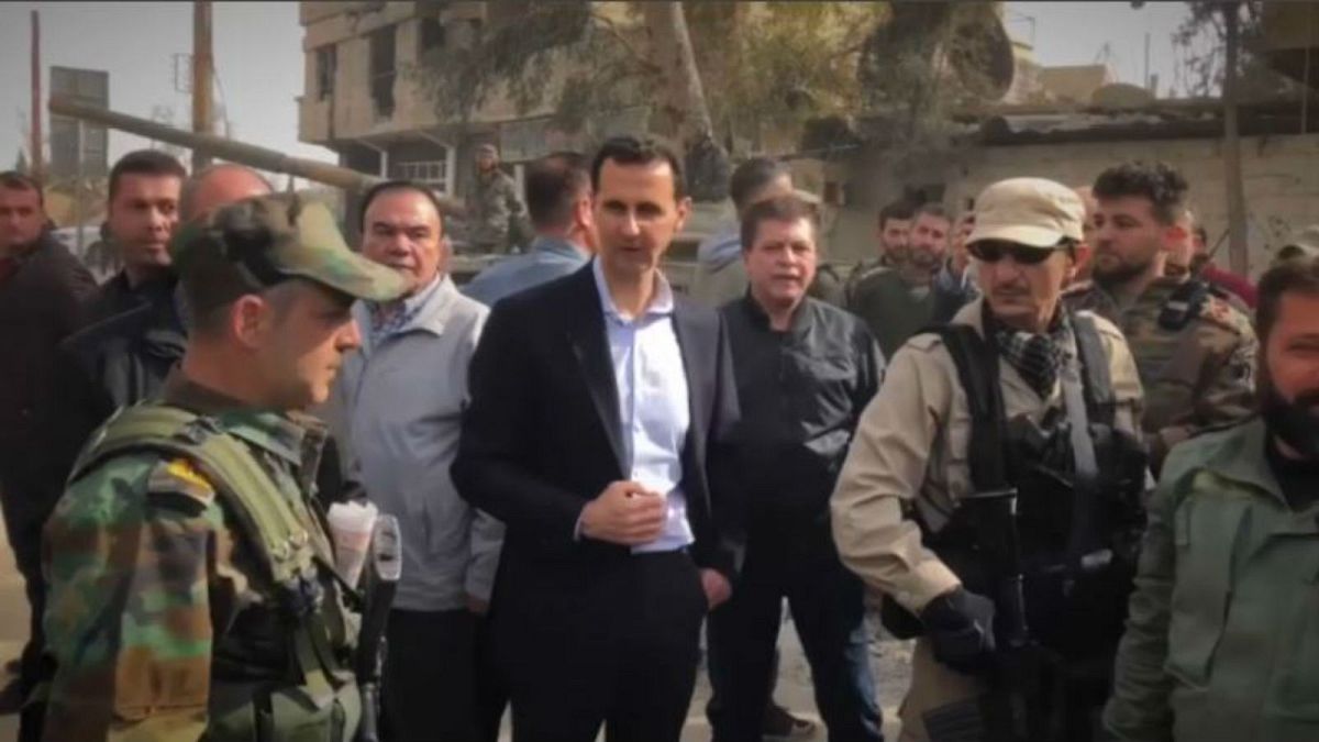 Assad visits troops in Ghouta as civilians flee