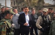 Assad visits troops in Ghouta as civilians flee