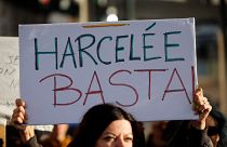 A placard is held during a protest against sexual violence in Marseille