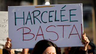 A placard is held during a protest against sexual violence in Marseille