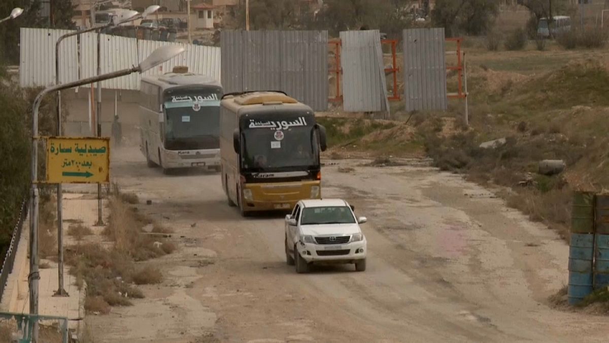 Coaches filled with opposition fighters are leaving Ghouta