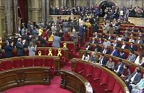 Catalan parliament suspends vote on detained new president