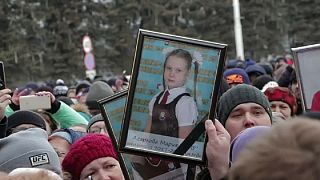 Grief and protest in Russia over fire that killed tens of children