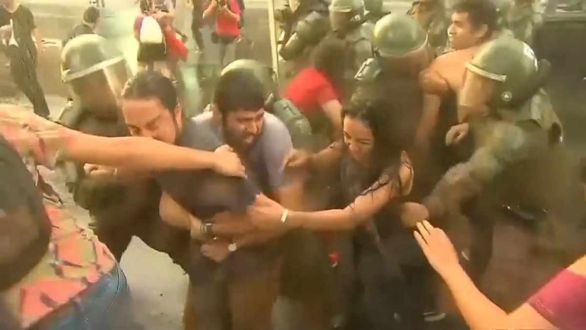 Demonstrators clash with police in Chile over for-profit school ruling