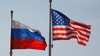 National flags of Russia and the U.S. fly at Vnukovo International Airport