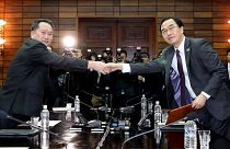 South Korean Minister Cho Myoung-gyon with his North Korean counterpart