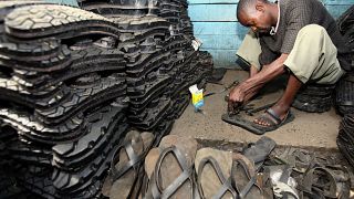 A man makes footwear from tyres in Ngara market, near Nairobi.