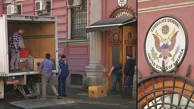 U.S. diplomatic staff load truck outside St Petersburg consulate