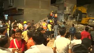 At least ten die as car brings down building in India