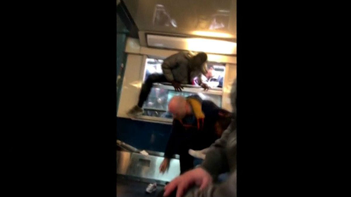 Paris passengers climb through train windows on first day of French rail strike