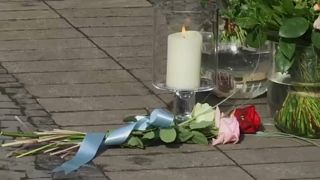 Flowers at the scene of the attack that killed two people on Saturday