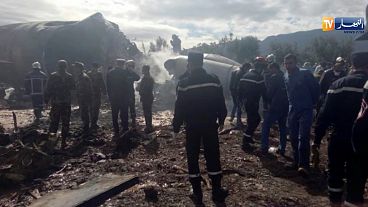 Rescuers at the scene of the crashed military aircraft