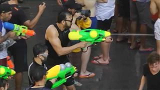 Thailand marks the Songkran festival with a water fight.