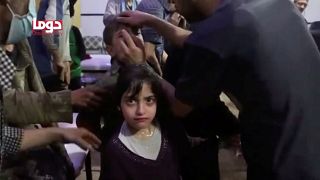Girl looks on following alleged chemical weapons attack, said to be Douma