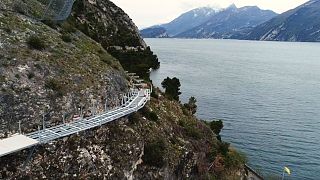 Breathtaking aerial footage shows Italy's 'floating' cycle path on Lake Garda