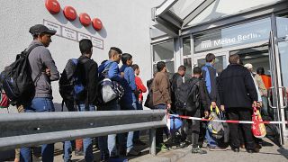 Migrants queue in Berlin (October 2015)