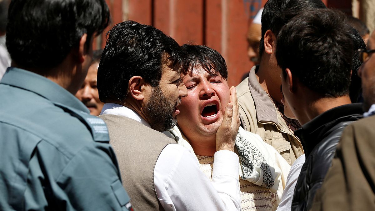 A man reacts at the site of a suicide attack in Kabul, Afghanistan 22/4/18