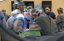 Doctors conduct the operation