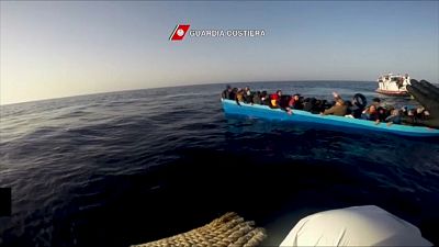 Italian coast guards rescue migrants as vessel capsizes in the Mediterranean Sea