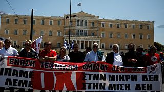 Workers in front of the parliament building in Athens, Greece.