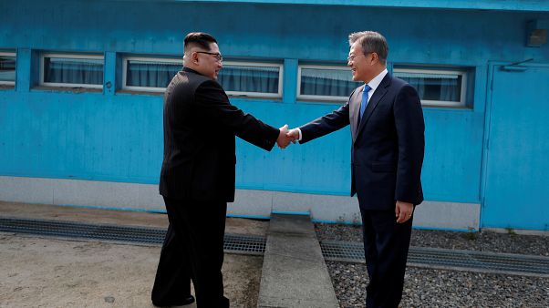 Kim Jong Un and Moon Jae-In shake hands over the border in April 2018 Kim Jong Un and Moon Jae-In shake hands over the border in April 2018