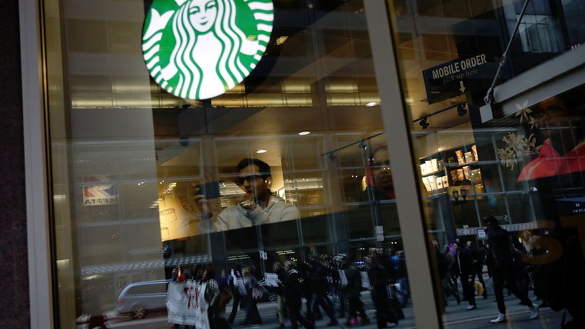 Black men arrested at Starbucks settle for $1 each and $200,000 programme 