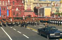 Putin reviews Russia's 'invincible weapons' in Red Square military parade