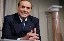Silvio Berlusconi grinsend