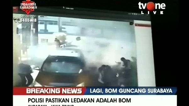 Indonesian police say sucide bombing family attacks Surabaya police headquarters Indonesian police say sucide bombing family attacks Surabaya police headquarters
