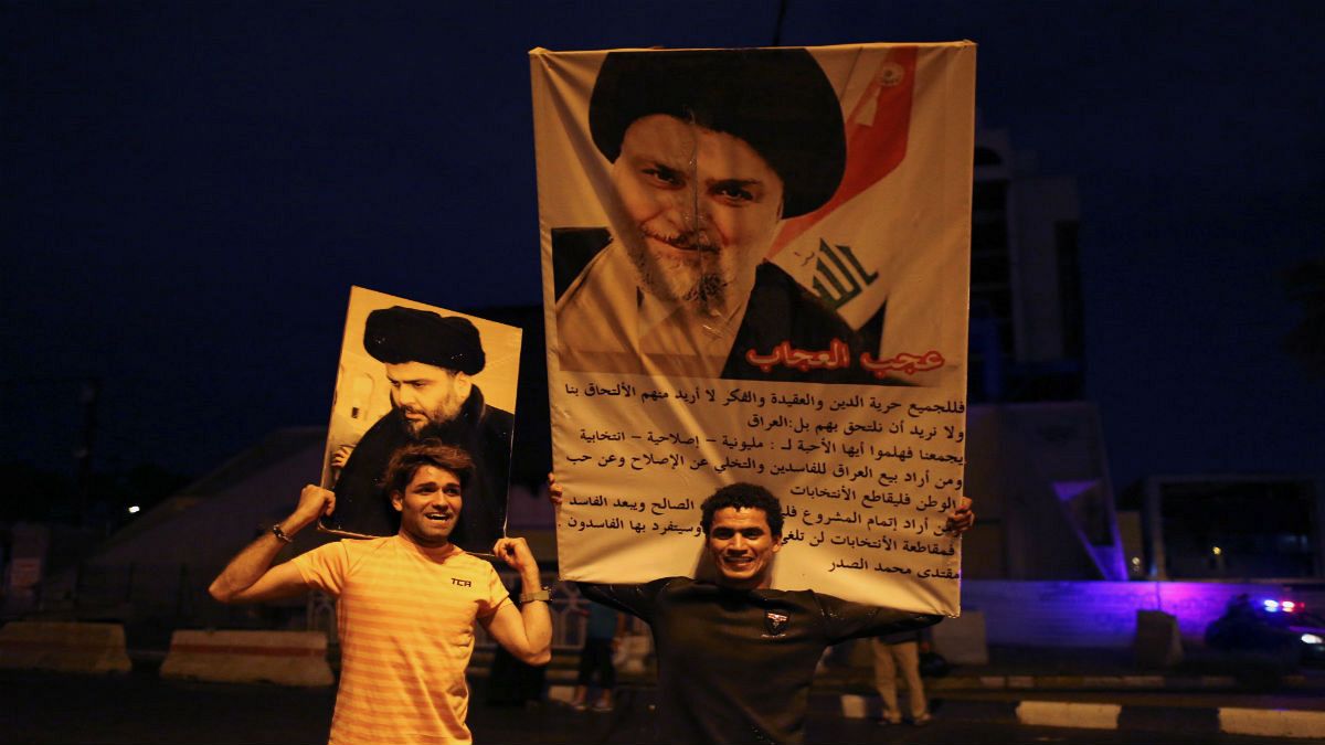 portraits of Shi'ite cleric Moqtada al-Sadr
