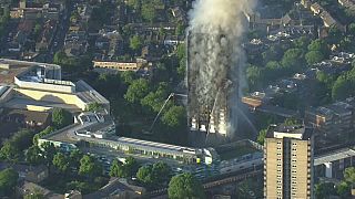 May bows to public pressure over Grenfell