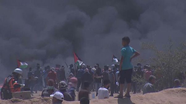 Gazans burn tyres in the hope smoke will protect them from Israeli snipers. Gazans burn tyres in the hope smoke will protect them from Israeli snipers.