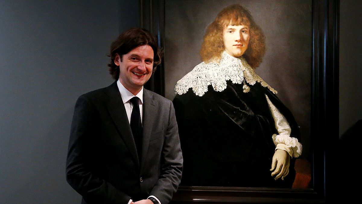 Art dealer Jan Six with the painting he says is by Rembrandt
