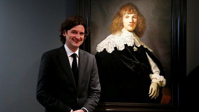 Art dealer Jan Six with the painting he says is by Rembrandt