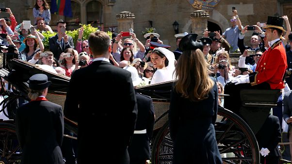 The newlyweds leave St George's Chapel in Windsor The newlyweds leave St George's Chapel in Windsor