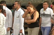 Relatives of Cuba plane crash victims collect their loved ones' possessions