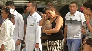 Relatives of Cuba plane crash victims collect their loved ones' possessions