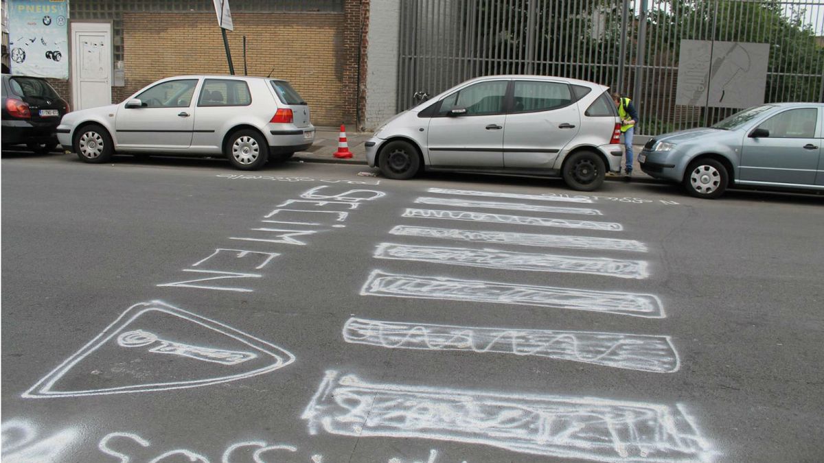 Activists paint their own pedestrian crossing on deadly Brussels street