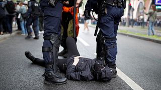 Police and protesters clash in Paris