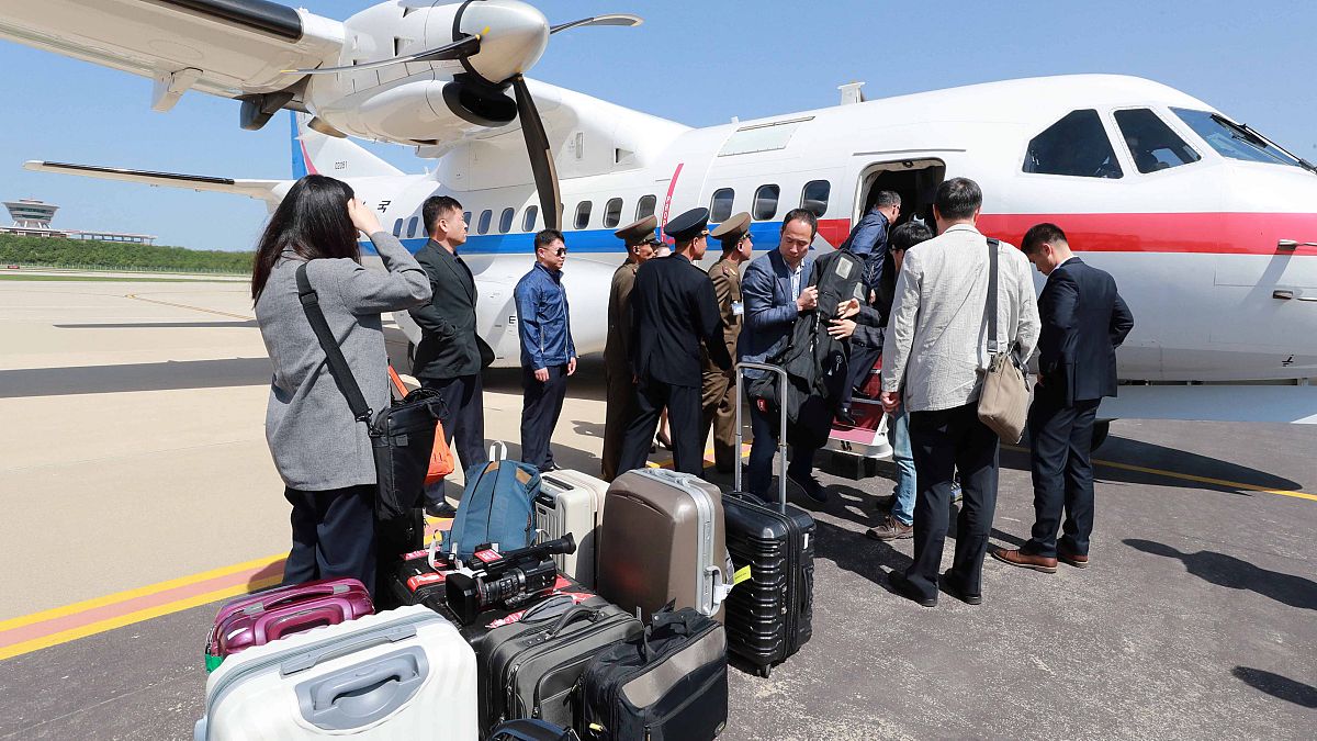 South Korean journalists board a plane for Pyongyang