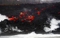 Lava pours into the ocean during the eruption of the Kilauea Volcano