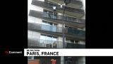 Malian migrant Mamoudou Gassama scales a building to save a young boy