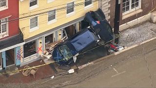 Flood waters recede in Maryland  leaving everywhere coated in mud