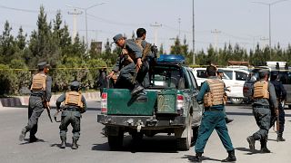 Afghan police arrive at the scene of the attack
