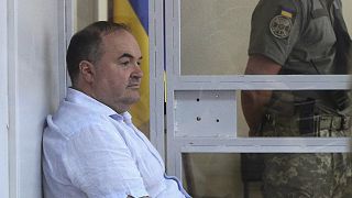 بوريس هيرمان أثناء التحقيق معه في المحكمة في كييف - المصدر: رويترز.